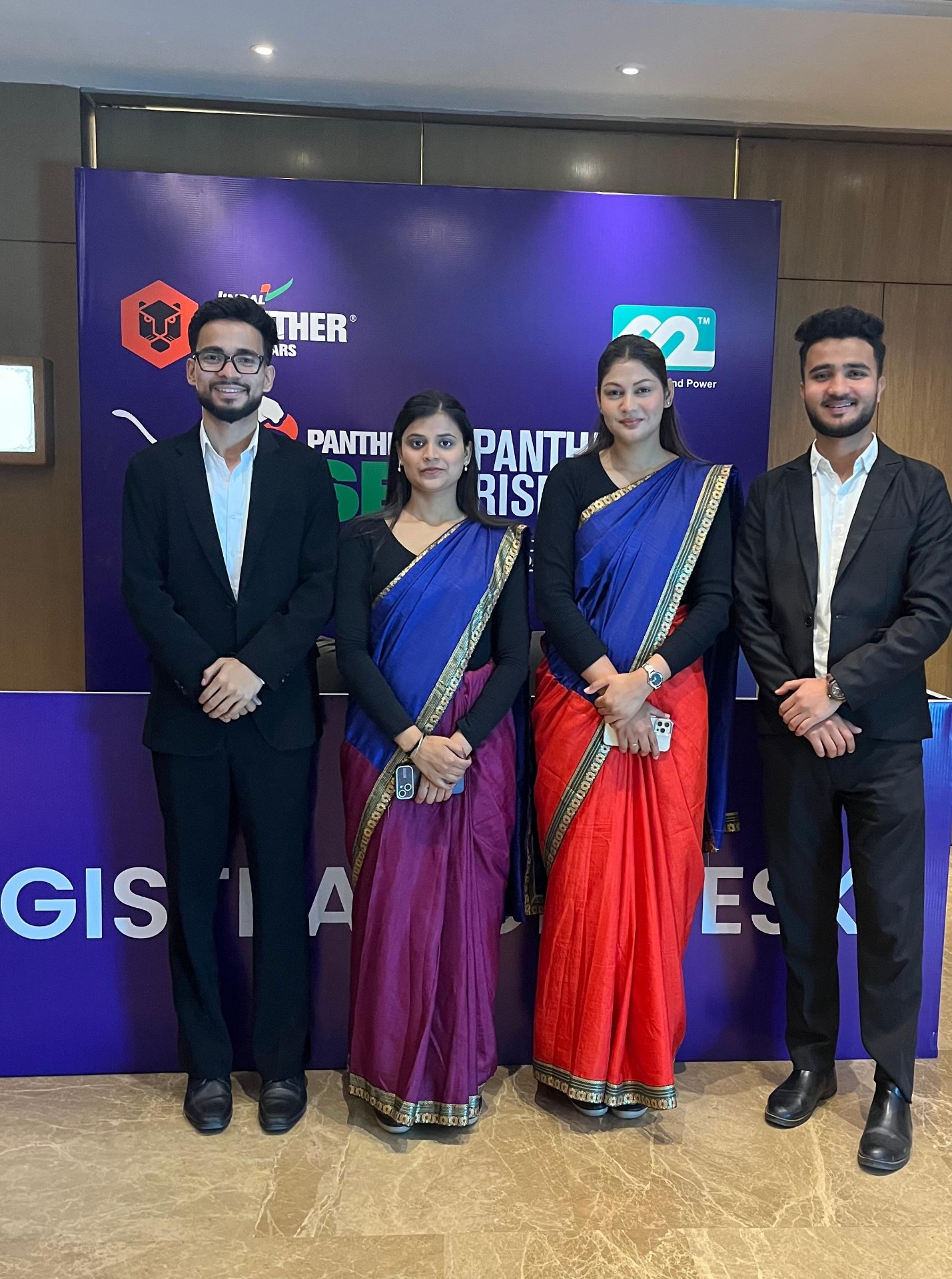 Harmony guest relations team at a corporate conference desk